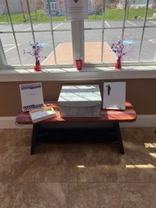Letter Writing setup in the HW Clubhouse entryway. Stationery is available and a box to put your letters in. Thank you!