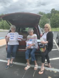 Karen Wilson, Vern Loschi, Ellen Medeiros and Ann Perham packed the donations for transport.