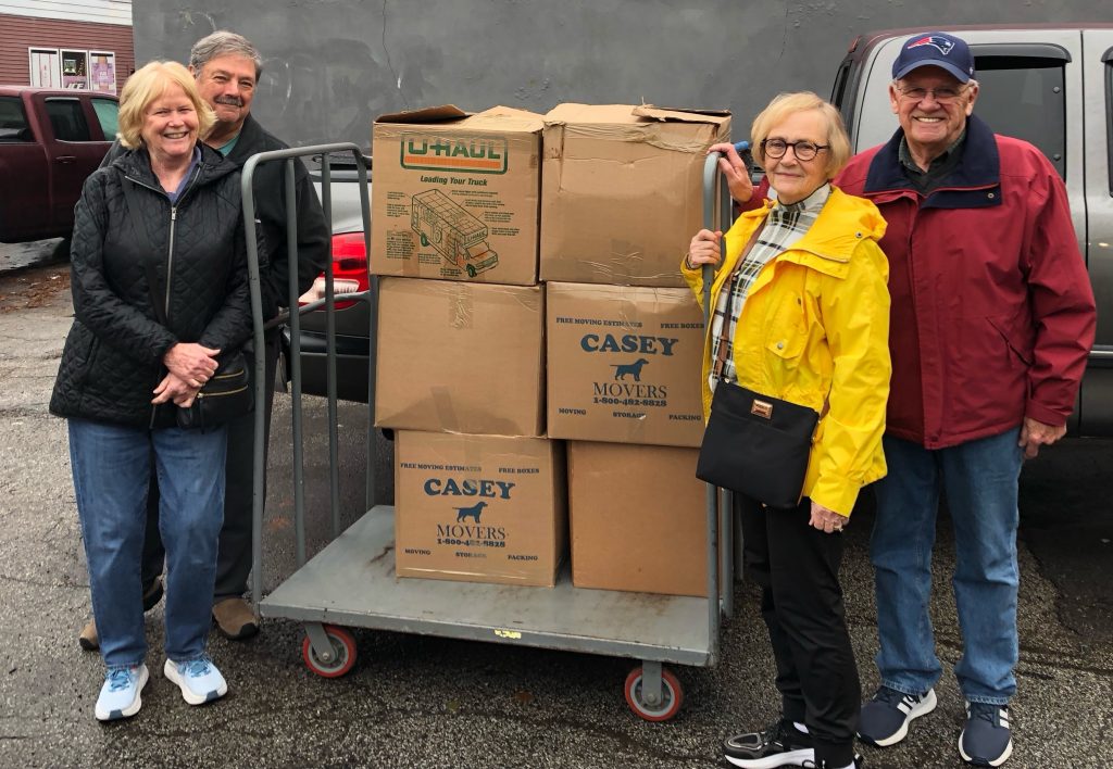 (l-r): Maryellen McGrath, Bob McGrath, Phyllis and --- delivered 239 backpacks to New Horizons.