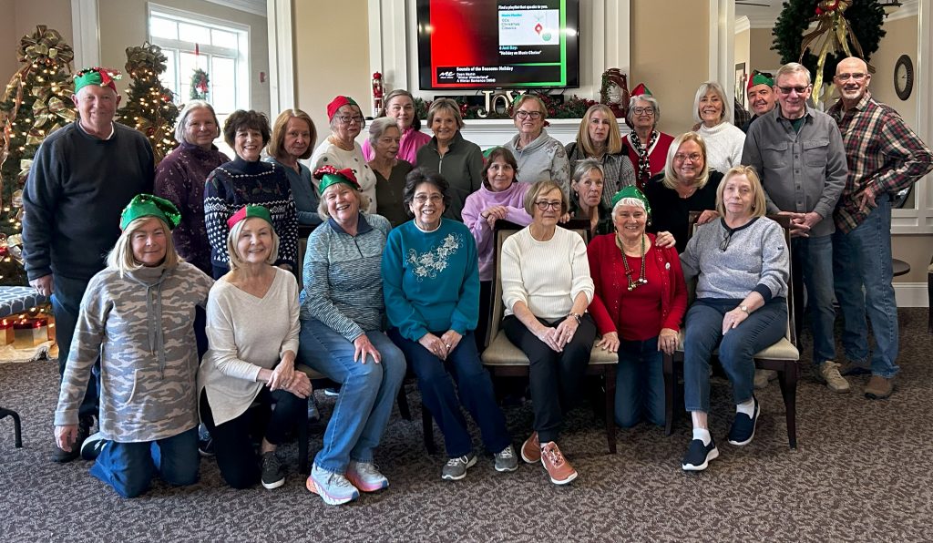 Assembling the bags on November 30, 2023:(front) Donna Tuzzolo, Mary Doherty, Maryellen McGrath, Dale St.Louis, Phyllis Morris, Denise Penaskovic, Ellen Medeiros; (middle) Cathy McMullen, Paula Zuccaro, Sue Orr; (standing) Terry McDonough, Judy Goglia, Linda Kelly, Sheila Jenkins, Roberta Wells, Emma Greenhalgh, Joanne Fallon, Lou Pellerin, Doyle, Priscilla McDonough, Karen Wilson, Piekos, John Goglia, Orr, Bob Zuccaro. (Not in picture, Bob McGrath, Ann Perham)